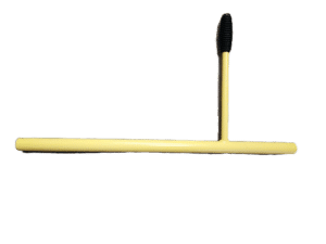 Yellow PVC pipe arranged in a horizontal bar with a vertical segment ending in a black ribbed connector against a green background.